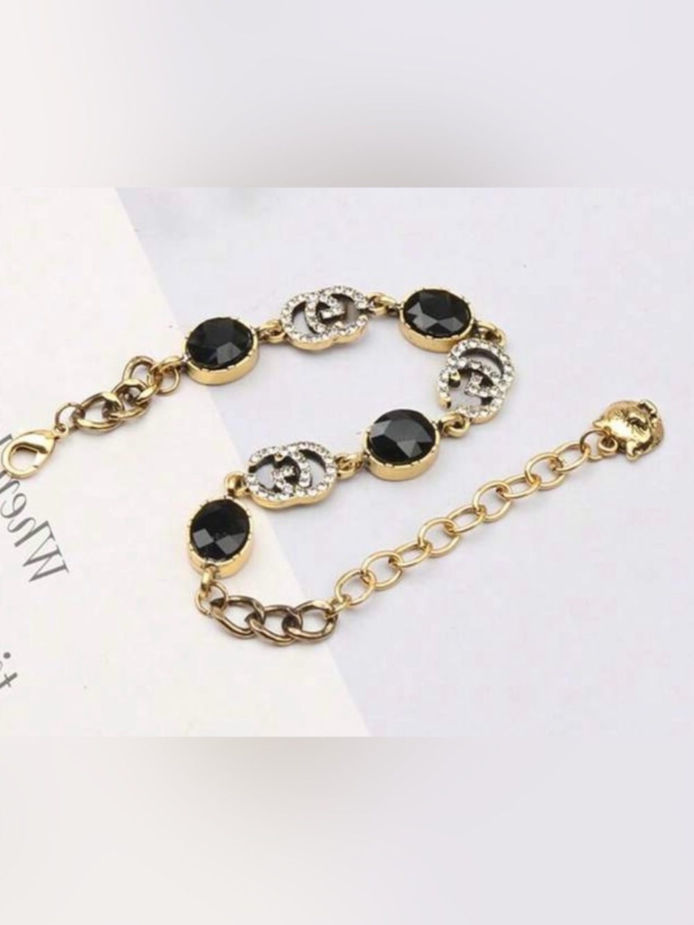 Gold Tone Letter G Bracelet with Black Stones and Clear Crystals